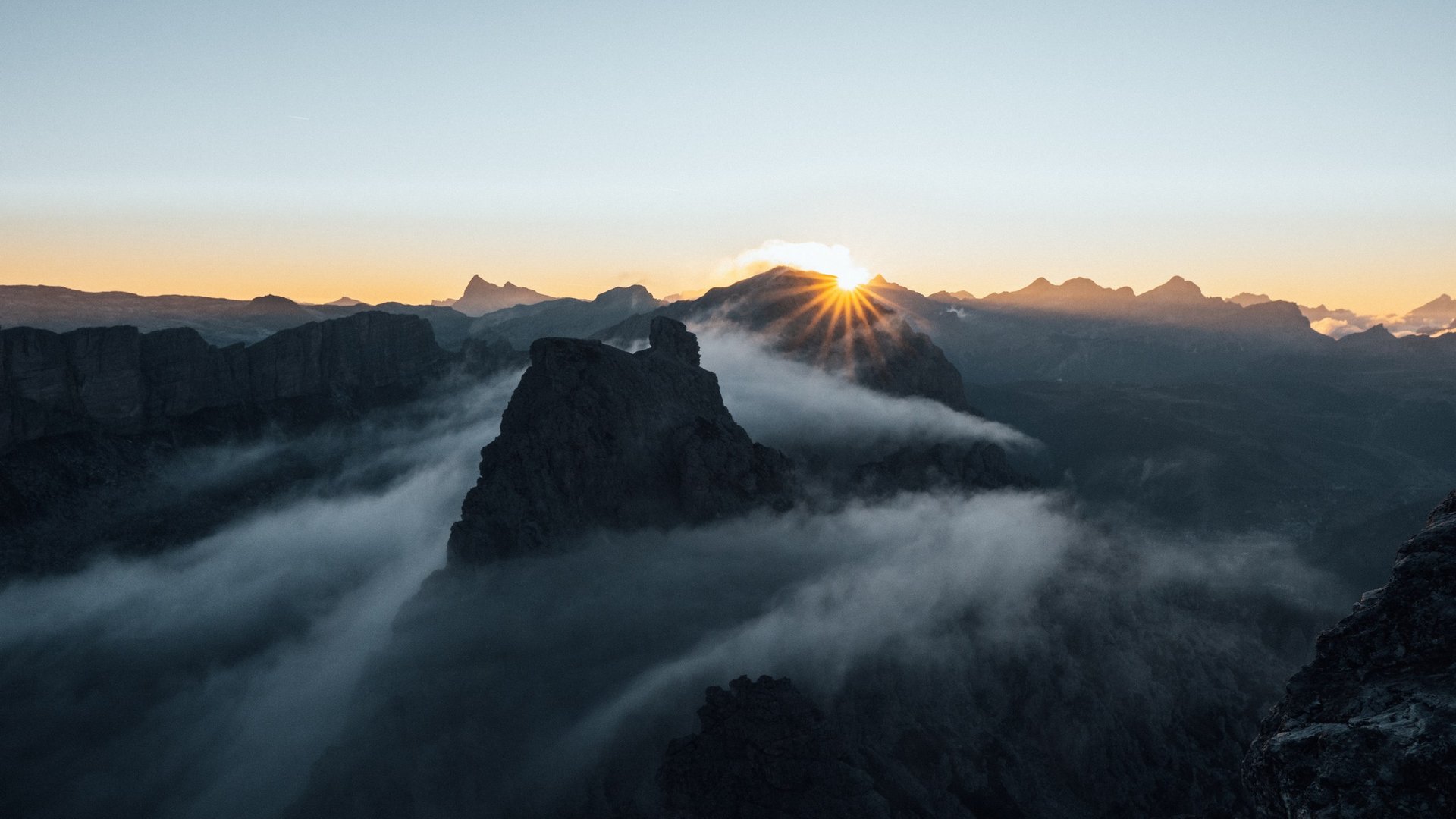 Active holidays in South Tyrol – ready for pure nature? Sunrise over misty mountains with clear sky